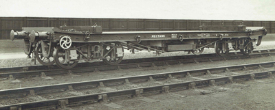 1 A black and white image of a trailer on a railway line.
