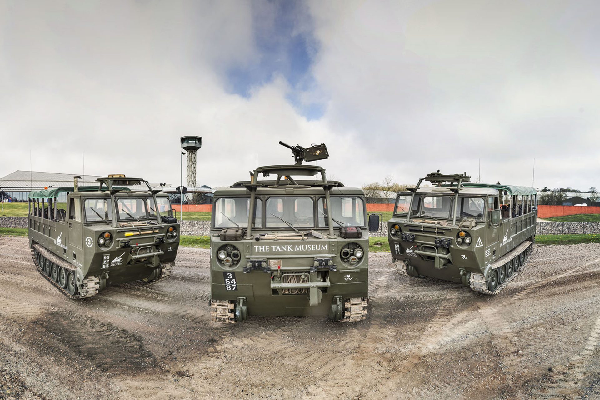 Three tracked transport vehicles.