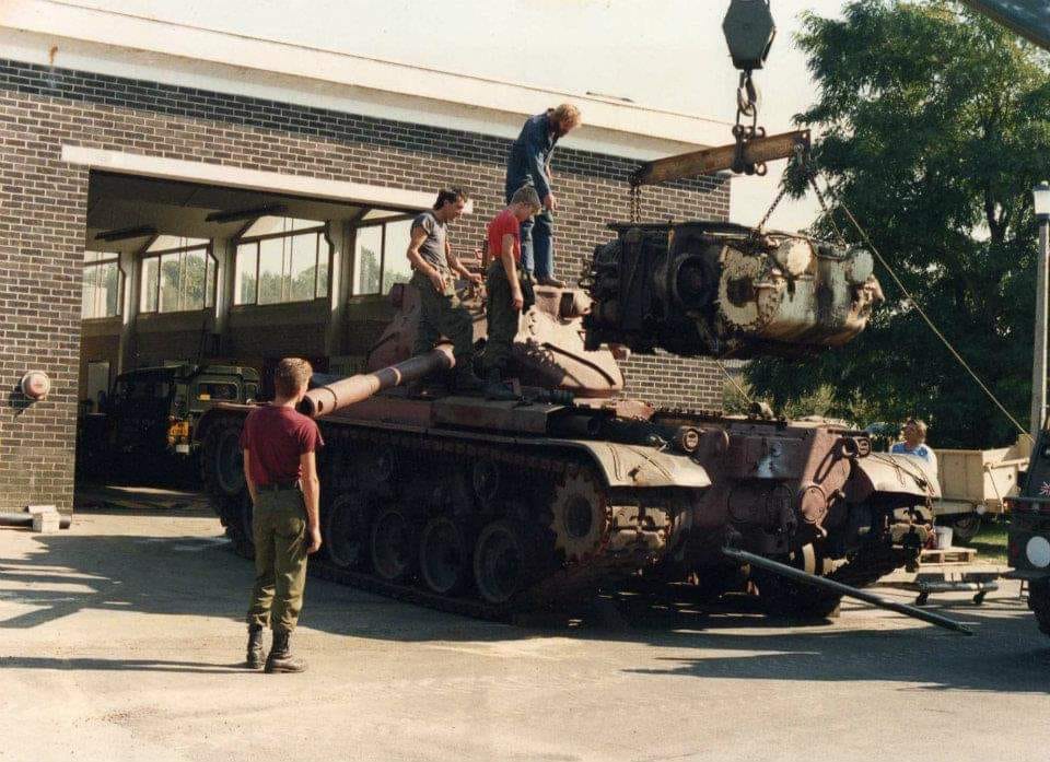 Mark Randall Lifting the M47's power pack. Nick emery, chatty, Pete galley, andothers.