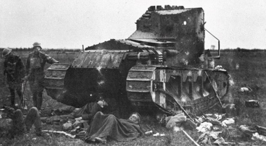 Dracula Lieutenant clement Arnold’s Medium A Whippet tank `Musical Box’ photographed on the 9th August, 1918. Three German soldiers take an impromtu nap in front, whilst both a German and British officer stand off to the side. Rifles and various kit lay scattered about.
