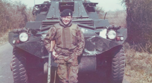 Ken 'Scouse' Lindores - bridge too far photographer Northern Ireland during 3rd RTRs Op Banner stint in 1973. Ken `Scouse’ Lindores pictured leaning on a rather beaten-up Saracen Armoured Car, clad in DPM, flak jacket and RTR beret, and holding an SLR rather than his usual Sterling SMG.
