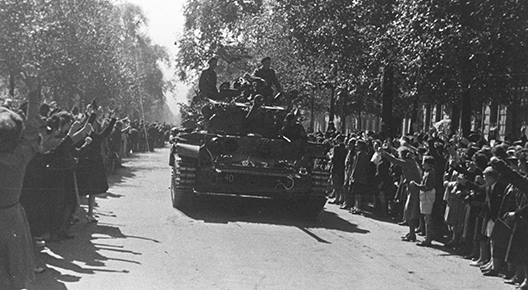 Blog 1 feature GAD Brussels An A27M Cromwell IV, Guards Armoured Division HQ moves through the throng of people celebrating the liberation of Brussels, 3rd September 1944.