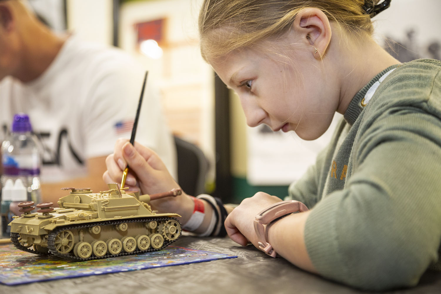 Model Show 2 Child painting a model tank.
