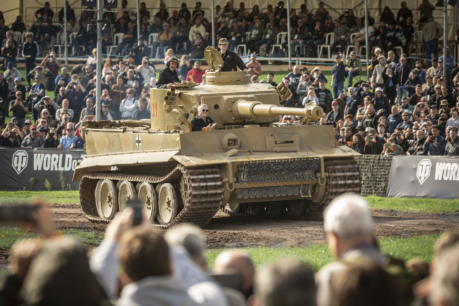 Tiger Day September 2024_536 Large dark yellow tank with crowds of people in the foreground and background.