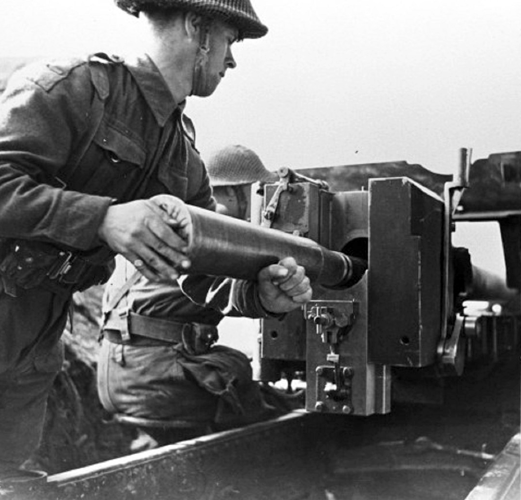 17 pounder breach comet gun article Black and white image of British crewmen loading a shell into the breach of a 17 pounder anti-tank gun