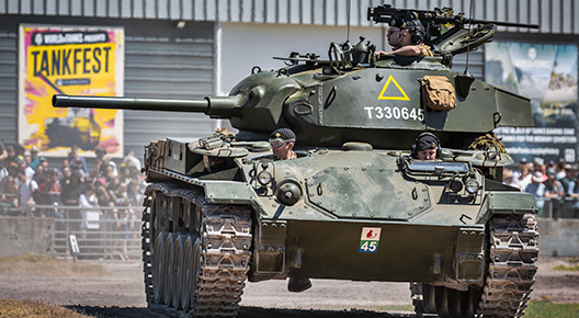 Chaffee Photograph of a green tank running on an earth track