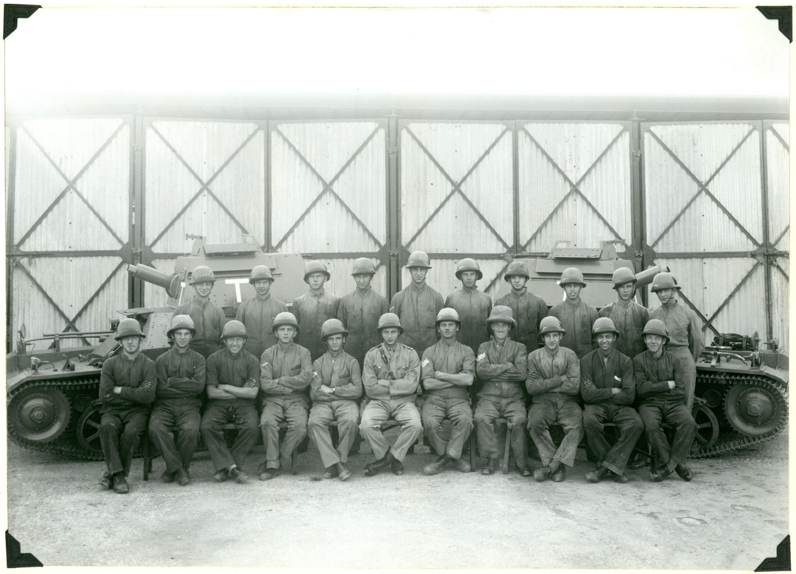 Lt Brown & Men No. 1 Section LTC Barracks - Reflections from the past article Black and white photograph showing Lieutenant A.W. Brown MC, NCOs and Men of No. 1 Section who took part in the Mohmand Operation 1935, taken at their barracks following their return.